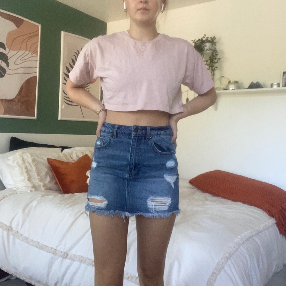 Ripped denim mini skirt